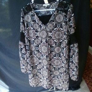 Soft, detailed dress with black lace